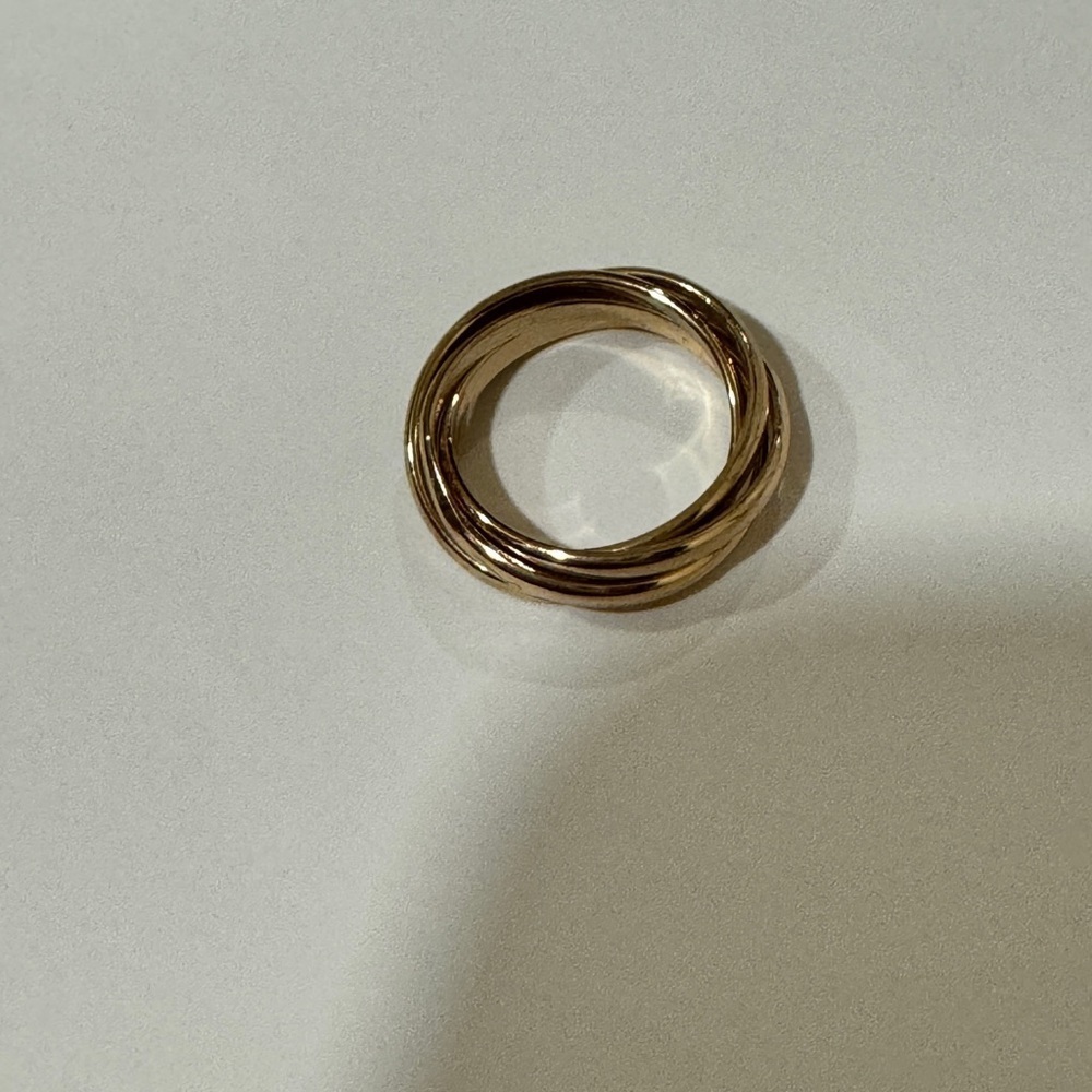 Gold toned interlocking ring​​​​​​​